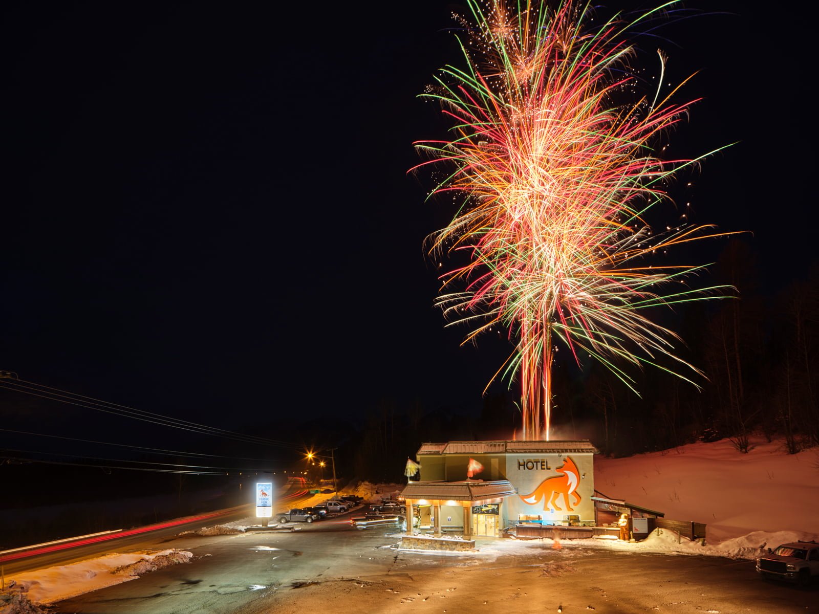 Fireworks being shot off the roof of the Fernie Fox Hotel to celebrate the hotel's rebrand as an accommodation provider in Fernie BC