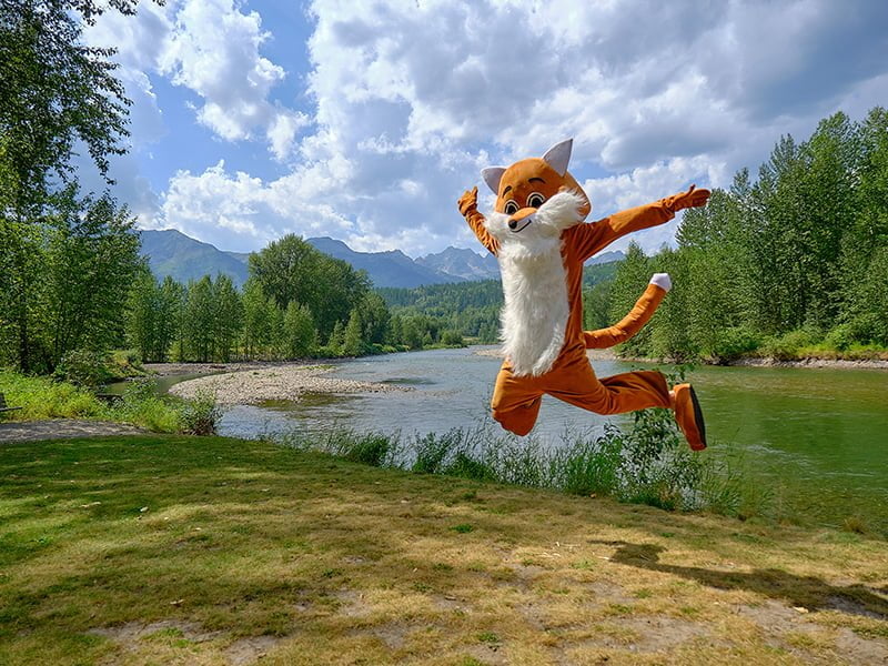 Fernie Fox mascot jumping for joy