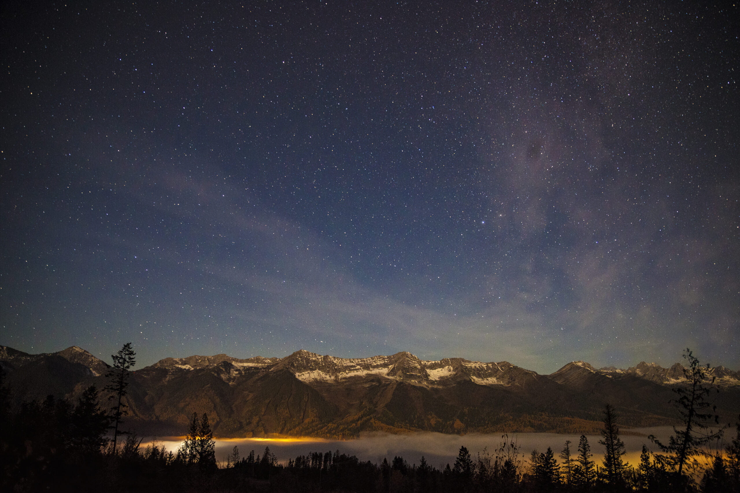 view of the lizard range and Fernie Alpine Resort with valley bottom fog.