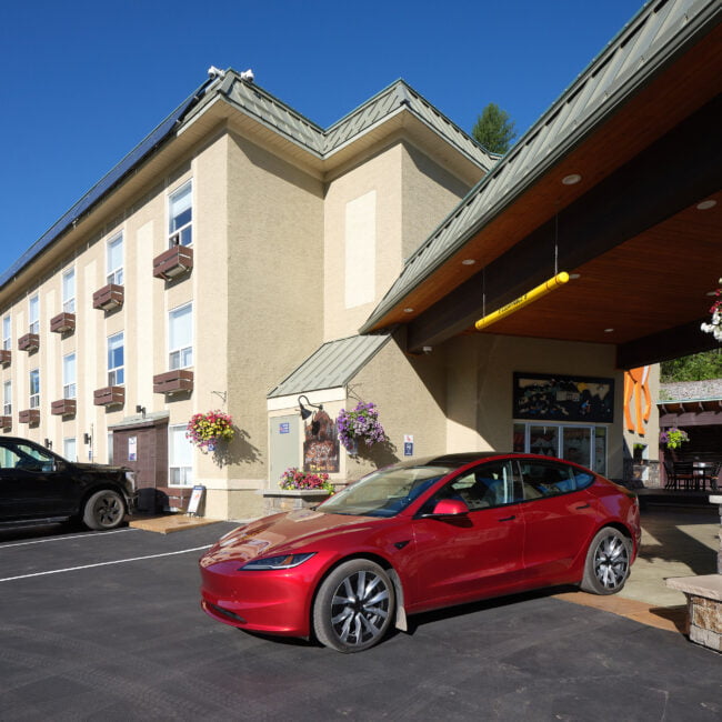 Tesla parked in front of Fernie Fox Hotel in Fernie BC